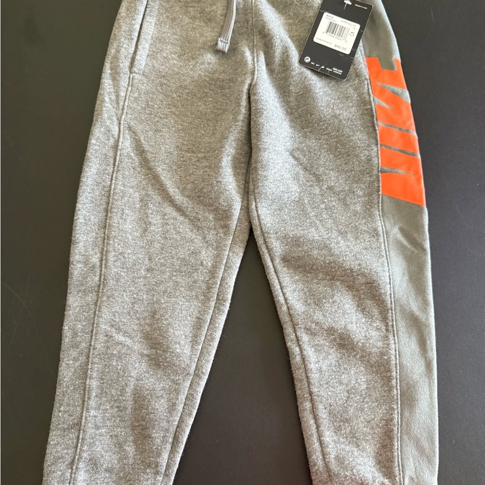 Nike Kids Gray Joggers with Orange Stripes